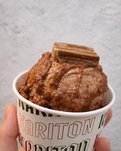 Chocolate gelato with a wafer in a Kariton cup